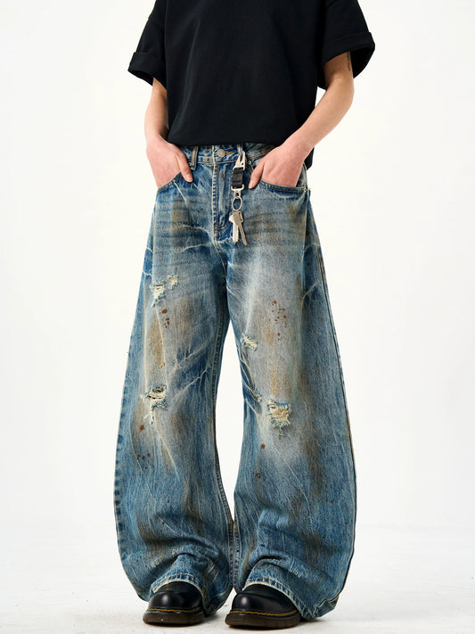Dirty Dyed Hole Scimitar Ink Jeans