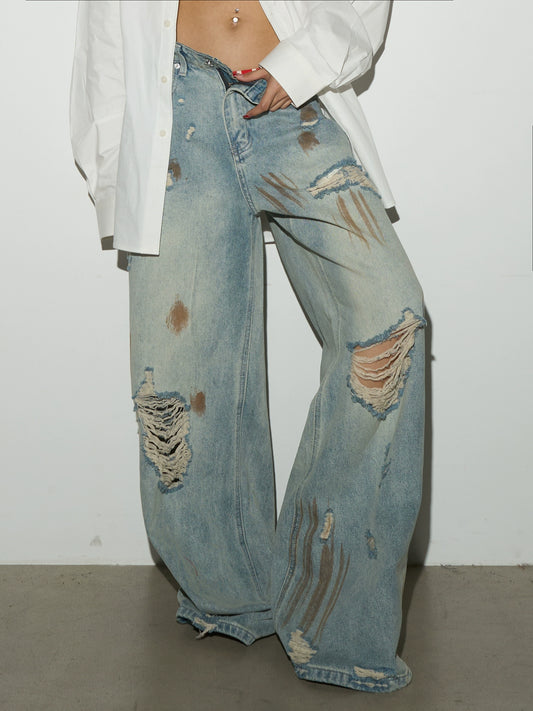 Dirty and Damaged Rusty Faded Jeans
